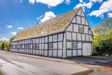 A grade II detached barn in a highly desirable village with three/four double bedrooms, en suite, family bathroom, shower room, kitchen, great hall/ sitting room, snug, utility room, garden room, garage, charming garden and parking. This property ret...