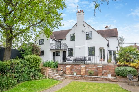 An attractive detached family home built in the late 1920's in an Arts and Craft cottage style, this superb property occupies a prominent position in a quiet lane in the popular village of Wollaston. The house is beautifully presented and offers spac...