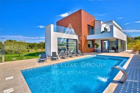 ALPHA LUXE GROUP is selling a modern luxury villa with a panoramic sea view, Višnjan, ISTRIA The villa is in a quiet village on a small hill with a panoramic view of the sea and beautiful landscape. It is only 15 km from Poreč, where you can find all...