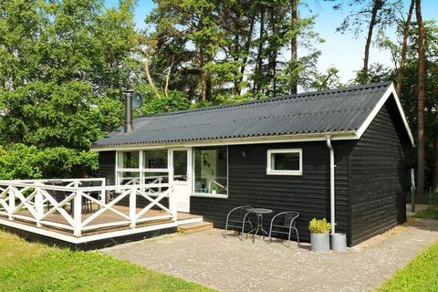 Holiday home located a few minutes walk from the water and within walking distance to Øster Hurup town. Bright living room with wood burning stove and sofa bed in open connection to the dining room and with access to the terrace. Screened sleeping ar...