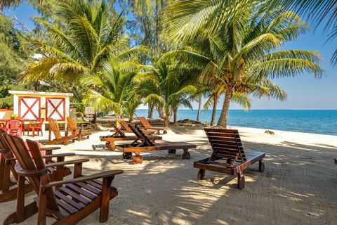 Belize Income Producing Guesthouse in Hopkins MLS #: H122310H Nestled along the pristine shores of Hopkins, Belize, this stunning seafront guest house offers unparalleled views and a taste of luxury. Imagine waking up to the gentle sound of waves lap...