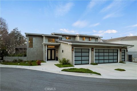 Welcome to 22835 Terrace View Drive, a magnificent custom, modern home, that seamlessly combines contemporary design and architecture with the timeless appeal of mid-century style. Nestled in the prestigious Bella Vista Estates of Newhall, California...