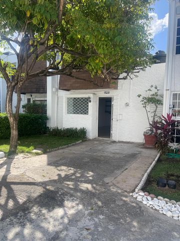 Townhome centrally located with 3 bedrooms, 2 bathrooms ( 2 bedrooms upstairs with 1 bath ) and (1downstair with 1 bath), was area, living and dining combined and kitchen in a gated complex.
