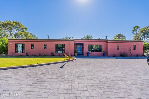 Tucson Country Club gated community, beautifully remodeled home. Every square foot of the home has been completely remodeled with two living spaces. Main house has large kitchen, separate dining, open concept, two living rooms. 2.5 bath, separate gue...