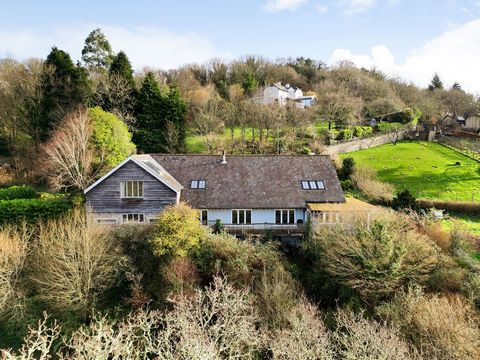 Introduction Combe Barn is set in a wonderful position with 8.30 acres of land on the edge of the popular village of Lustleigh within Dartmoor National Park. The property has been developed by the current owners and offers 5358 square feet of large, ...