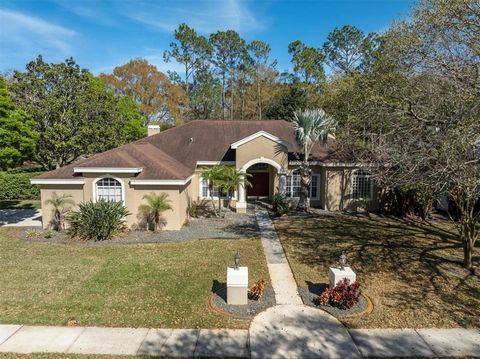 Located in coveted East Lake Corridor of Palm Harbor in the sought after Ivy Ridge at Lansbrook. This home is nestled on an oversized corner lot backing to the private landscaped berm. Enter the foyer to the separate formal living room and divining r...