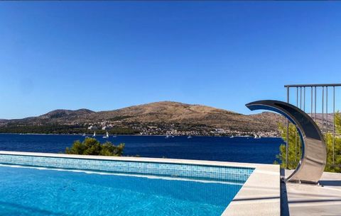 Extraordinary new modern villa on the first line to the sea on Ciovo! Fascinating sea views and views over old town of Trogir and Seget! Villa belongs to newly built condominium of contemporary villas to be completely finished by June 2021. Noone eve...