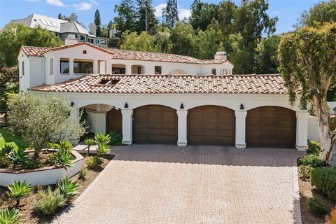 Rare opportunity to indulge in the charm of this 5 Bedroom, 5 Bath Spanish Santa Barbara style home with main floor ensuite, gracefully positioned on a spacious 17,000 sq. ft. lot and offering the utmost privacy. Located in the highly desired communi...