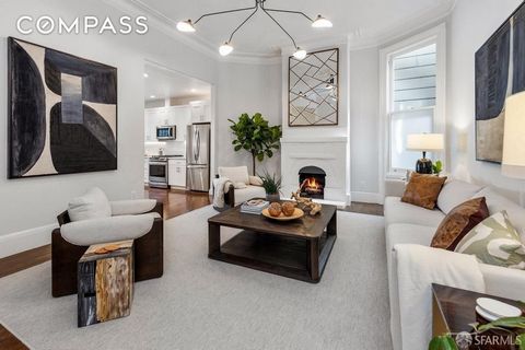 Stunning, house-like condominium in coveted Hayes Valley! This meticulously renovated home spans 2 levels, 4 bedrooms and 3 baths, and features soaring ceilings, original 1800s Victorian millwork, and modern amenities. At the entrance is a sunny bedr...