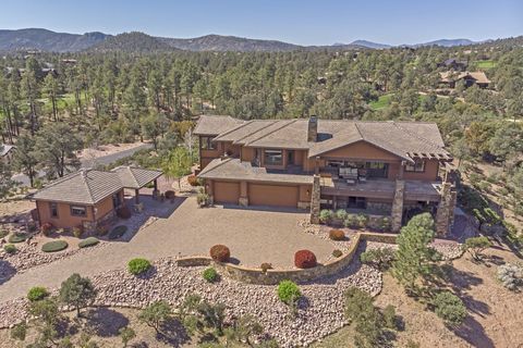 The home features commanding, panoramic mountain views of the Mogollon Rim and Diamond Point, with attention to detail and interesting architectural features inside and out. The front elevation combines an interesting combination of Tuscan and Crafts...