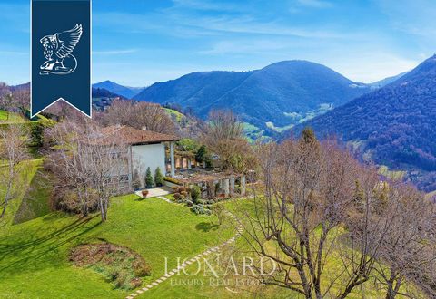 Nestled atop the serene hills of Bergamo, this luxurious villa with a swimming pool is for sale. Spread across 2.2 hectares, the property boasts a classic and elegant design, offering panoramic views of the valley below. Comprising a main villa, an a...
