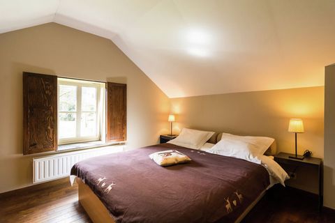This 9-bedroom holiday home in Gedinne lies in a beautiful leafy area between Bouillon and Dinant. It comes with a private sauna and private bubble bath to unwind after having a hectic day. The holiday home is perfect for 18 persons, be it staying wi...