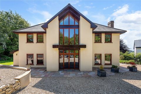 A magnificent contemporary, five-bedroom, five-bathroom detached residence & wood cabin set in a secluded position at the end of a private road, enjoying far reaching views over the village of Uplyme. Fine and County are delighted to present this sig...