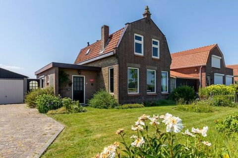 This characteristic house, with a 1930s look & feel, is rurally located in the village of Zuidzande in Zeeuws-Vlaanderen. With a wide view over the farmlands behind the house, you will experience a maximum feeling of peace and space here. The attract...