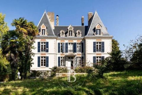 The building is situated between Salies de Béarn and Orthez and was constructed in 1898 with approximately 520m2 of living space on 3 floors and 170 m2 to exploit on the garden level. There are many original features including parquet floors, doors a...