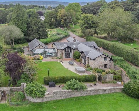 Nestled in the Monmouthshire countryside in the highly desirable village of Bettws Newydd, overlooking its own grounds and the woodlands of the Usk Valley, sits this magnificent, high quality country property. A rare find, this large five-bedroom hom...