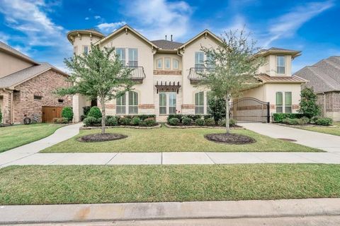 Luxurious Mediterranean estate in Lakes of Bella Terra's gated community. This stunning 5-bedroom home boasts individual baths for each room, including a convenient Mother-In-Law Suite on the main level. The gourmet kitchen features a massive island ...
