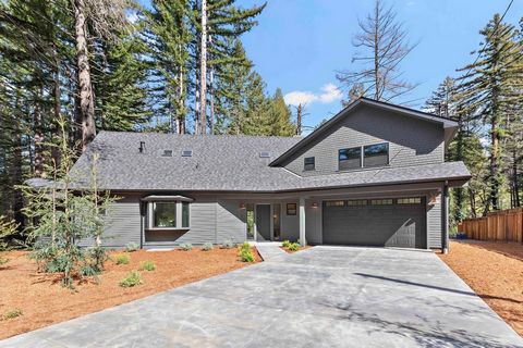 Stunning new construction nestled among mature trees overlooking a tranquil creek ~ Light and bright contemporary interior with a great floor plan featuring 20 foot + vaulted exposed beam ceilings, complementing the family room, dining room and kitch...