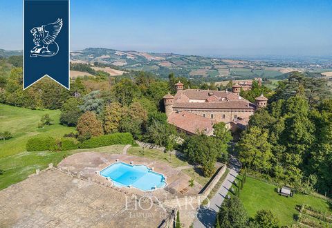 In the leafy landscape offered by Emilia's hills, between Piacenza and Milan, there is this majestic prestigious castle dating back to the 10th century for sale. This ancient fortification has a trapezoidal plan and a large internal courtyard. A...