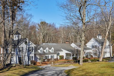 Peace and tranquility await at this sprawling country retreat. A stream meanders through the 15.37 acre property forming two waterfalls and flows into a deep water pond creating a beautiful lush landscape viewed from many vantage points. This amazing...