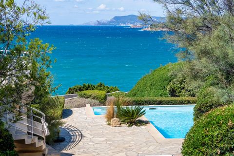 Pride of place, waterfront property. Located in the sought-after La Cride district, this 218 m2 architect-designed villa is set in 1930 m2 of land with direct access to the sea. Panoramic sea view. Swimming pool. Its light filled interiors are airy a...