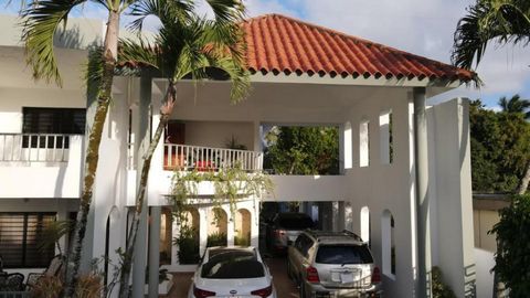 Spectacular two-level house with a 5-level structure, it is located in the center of Higuey, close to commerce. It has two grandiose gardens, both in the front and behind with fruit trees. The canopy is for 7 vehicles, 3 indoors. On the first level i...