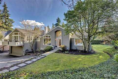 Charming Medina home nestled in a private, serene setting and merely steps from Overlake Golf & Country Club. This exquisite hidden gem has been remodeled to showcase timeless elegance and sophistication that provides a lifestyle of privacy and comfo...