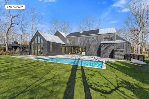 Welcome to your breathtaking waterfront retreat overlooking the tranquil beauty of Lily Pond! Just minutes from Sag Harbor Village, this new construction modern masterpiece offers unparalleled luxury and serenity. This home was just completed by Jeff...