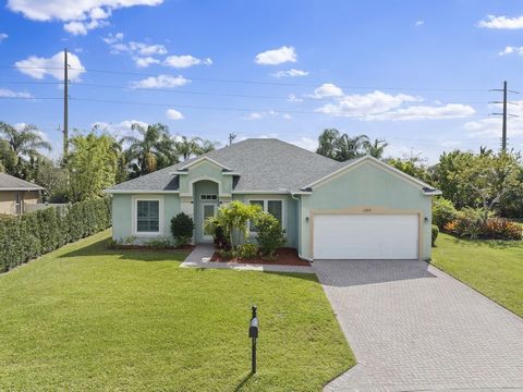 Gorgeous 4-bedroom, 2-bathroom plus Den home with a serene lake view, located in the sought-after Oaks of Vero Community! This home boasts a NEW ROOF, IMPACT WINDOWS, HVAC, and HWH, all completed in 2023 The open kitchen features quartz countertops, ...