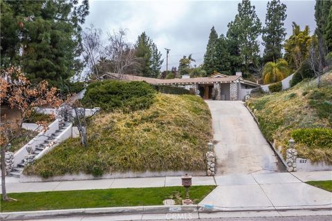 Priscilla Bowler, Listing Agent with Bennion Deville Homes, ... , ... - Surrounded by lush landscaping, perched above the beautiful neighborhood, this Redlands Country Club home will be your private paradise. Park like front yard leads to a stone pil...
