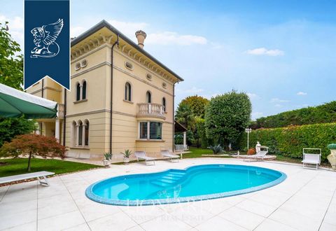 Nestled in a picturesque Veneto town amidst Treviso's vineyards, this exclusive modern villa, built in the early 2000s in the ‘Villa Veneta’ style, exudes elegance and luxury. Spanning 650 sqm across four levels, this estate boasts exquisite dec...