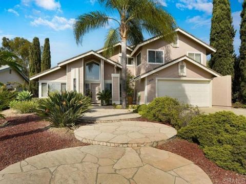 Encinitas Schools - 5-bedroom, 3-bathroom home located in the sought-after Santa Fe Glens community of La Costa. This spacious home sits on a large, flat lot with a beautifully landscaped yard featuring lush palm and fruit trees, perfect for outdoor ...