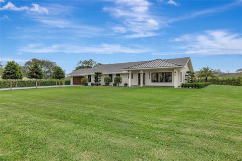 Nestled on nearly two acres, this 3,004 sq. ft. 4-bedroom, 3-bathroom home was remodeled in 2022 and features natural wood plank porcelain tile, quartz countertops, custom white oak cabinetry, Thermador appliances, a 36-inch gas rangetop, double oven...