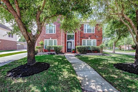 Welcome to this beautiful 4-bed, 3.5-bath home on a spacious corner lot in the heart of Cinco Ranch with exceptional curb appeal! Inside, soaring ceilings, neutral tones, gleaming tile floors, & abundant natural light greet you. A private home office...