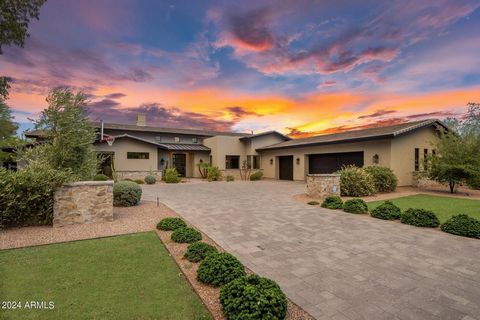 This custom Cactus Corridor estate impeccably blends luxury with functionality. Nestled on an impressive 1+ acre cul de sac street with no HOA, this transitional-style masterpiece, completed in 2017, offers stunning curb appeal and an expansive, open...