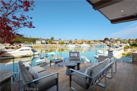 Incomparable, elegant, and utterly decadent, this estate delivers a spectacle of waterfront living that very few have the privilege to enjoy in the prestigious Back Bay community of Dover Shores. Impressively remodeled in 2017, the home carefully bal...