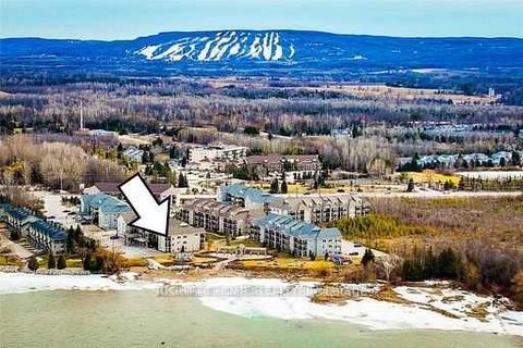 Lakefront Wyldewood Waterfront Cove Condo (2017) with Balcony overlooking Historic Lighthouse. Great for Ski and Beach Time with 2 Bedrooms and 2 Full Washrooms. Attached Storage Locker with Private Parking right below Condo. Lake Front View from Bed...
