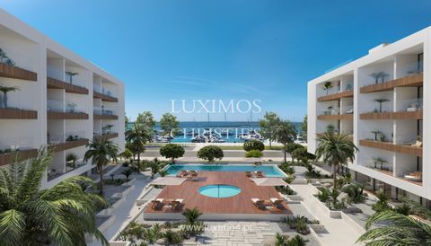 New seafront apartments in a private condominium for sale in Olhão, Algarve. Created with carefully designed finishes , the apartments benefit from a unique view of the Algarve coastline , and each has a large living room connected to a fully equippe...
