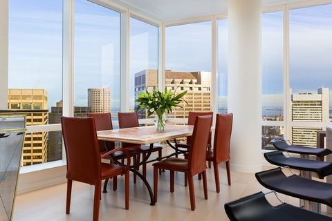 Experience the fantastic views of The Custom House, Zakim Bridge, and Boston Harbor from this 49th floor corner Grand Tower residence. Customized when purchased, this 3-bedroom, 3.5 bath home has a gracious marble foyer and a unique expansive footpri...