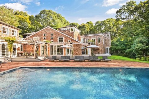 Located at the end of a quiet cul de sac within the coveted Bell Estate section of Amagansett, this exceptional home sits high on almost two acres of private grounds with 6500+/- SF across 3 floors of living space. Designed to showcase the splendor o...