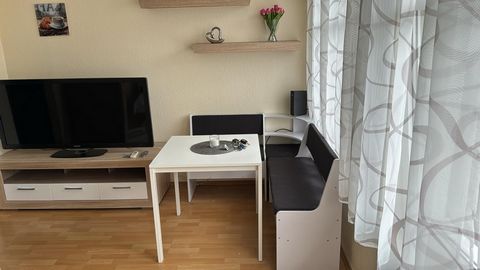 The apartment R04 is 30 square meters in size and is located on the mezzanine floor of an apartment building. It has a small entrance area, a bathroom with shower, a fitted kitchen and a living/bedroom for 1 person. The bathroom is equipped with a to...