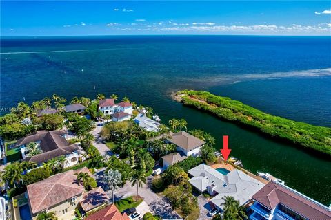 Boater's Paradise! A 12,000 square ft lot with 100 linear ft seawall. Prime location with views of Biscayne Bay which are wide open to the East and visible over a protective hedge of mangroves to the South. From your back door, be out on the bay in s...