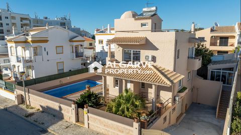 Located in Albufeira. This magnificent property features an entrance hall on the ground floor that leads to a spacious open-plan dining and living room adorned by a fireplace, with direct access to a fully equipped kitchen, laundry, and storage room....
