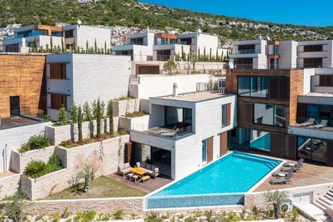 A luxury villa with an open sea view is for sale near the center of Primošten, only 10 meters from the sea, within a new modern community of 7 stylish villas! It is a superb gated condominium with no strangers! Villas are just completed in 2023 and b...