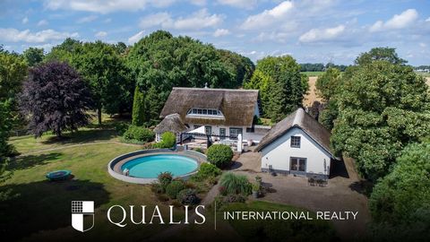 Would you like to live in a detached house with expansive views and horses on the property? At this beautiful thatched roof home, all of this is possible! The house is situated on a plot of land measuring a whopping 20,420 square meters. It features ...