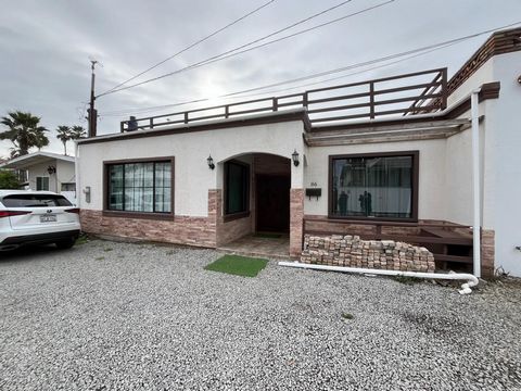 Amazing rosarito views beach house built just a year ago with high quality material. It has 3 bedrooms and 3 full bathrooms. One of the bedrooms has a separate entrance, allowing you to rent it out while you live in the house. The expansive terrace o...