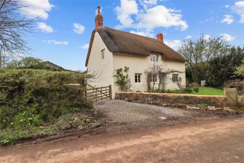 A wonderful extended and improved Grade II listed 3 bedroom thatched cottage of immense character and charm set in surrounding gardens with two large outbuildings providing garaging, workshop and studio/hobbies room with sauna, shower room and with e...
