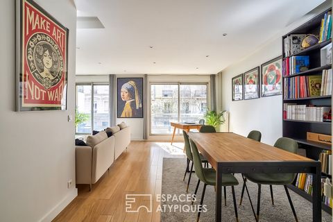 Ideally located, in the heart of the Asnières train station shopping district, in a quiet street, this apartment of 97.73 m2 carrez, offers an interior with beautiful volumes, a south-facing balcony and an independent workshop used as a game room, ar...