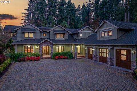 Experience the pinnacle of luxury living in this breathtaking Northwest Craftsman estate that captivated audiences as part of the 2006 NW Natural Street of Dreams. Tucked within the serene, gated enclave of Hidden Lakes in Oregon City, this 7,881-squ...