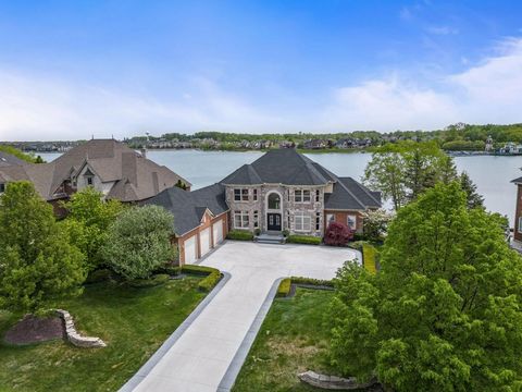 Luxury Living at 10751 Stoney Pointe Drive, South Lyon, Michigan 48178 Nestled in the prestigious gated community of Hidden Lake Estates, this stunning home at 10751 Stoney Pointe Drive offers a unique blend of elegance, comfort, and convenience. Des...